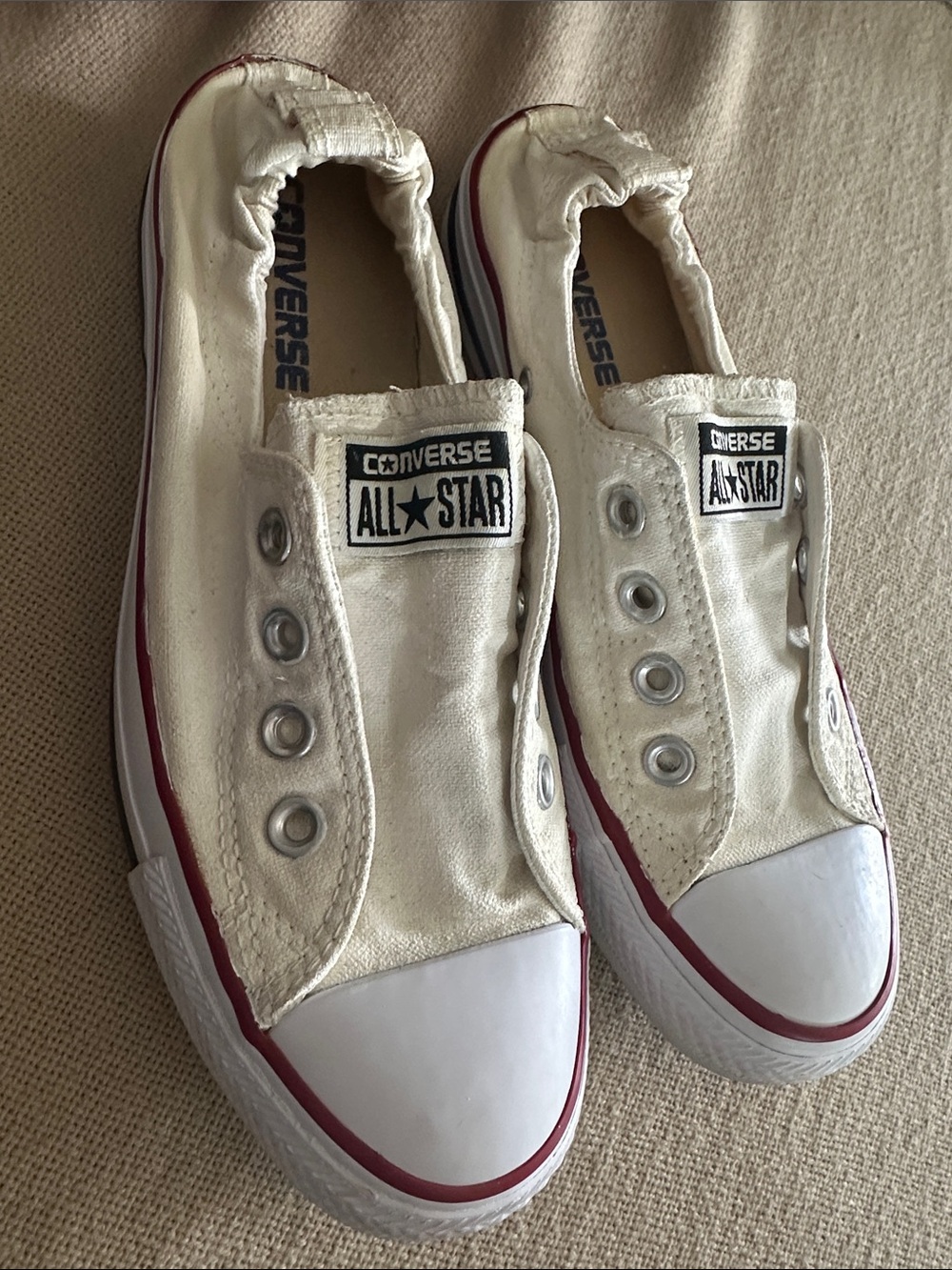 Converse Slip-On Canvas Sneakers in White with Red Trim